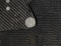 Österreichische 10-Groschen-Münze in der Spiegellagerung